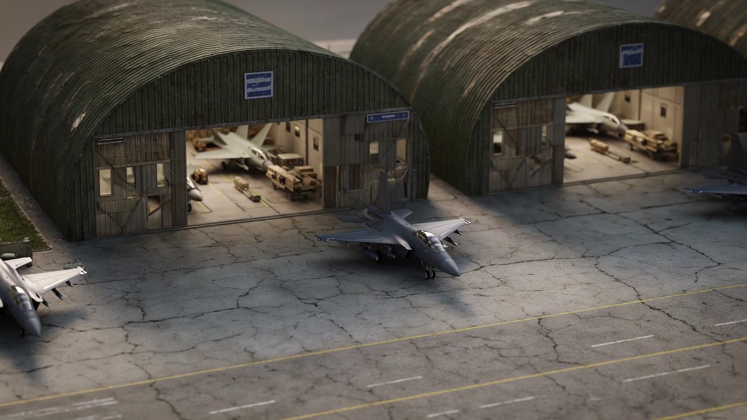 Airfield hangars with aircraft on the apron